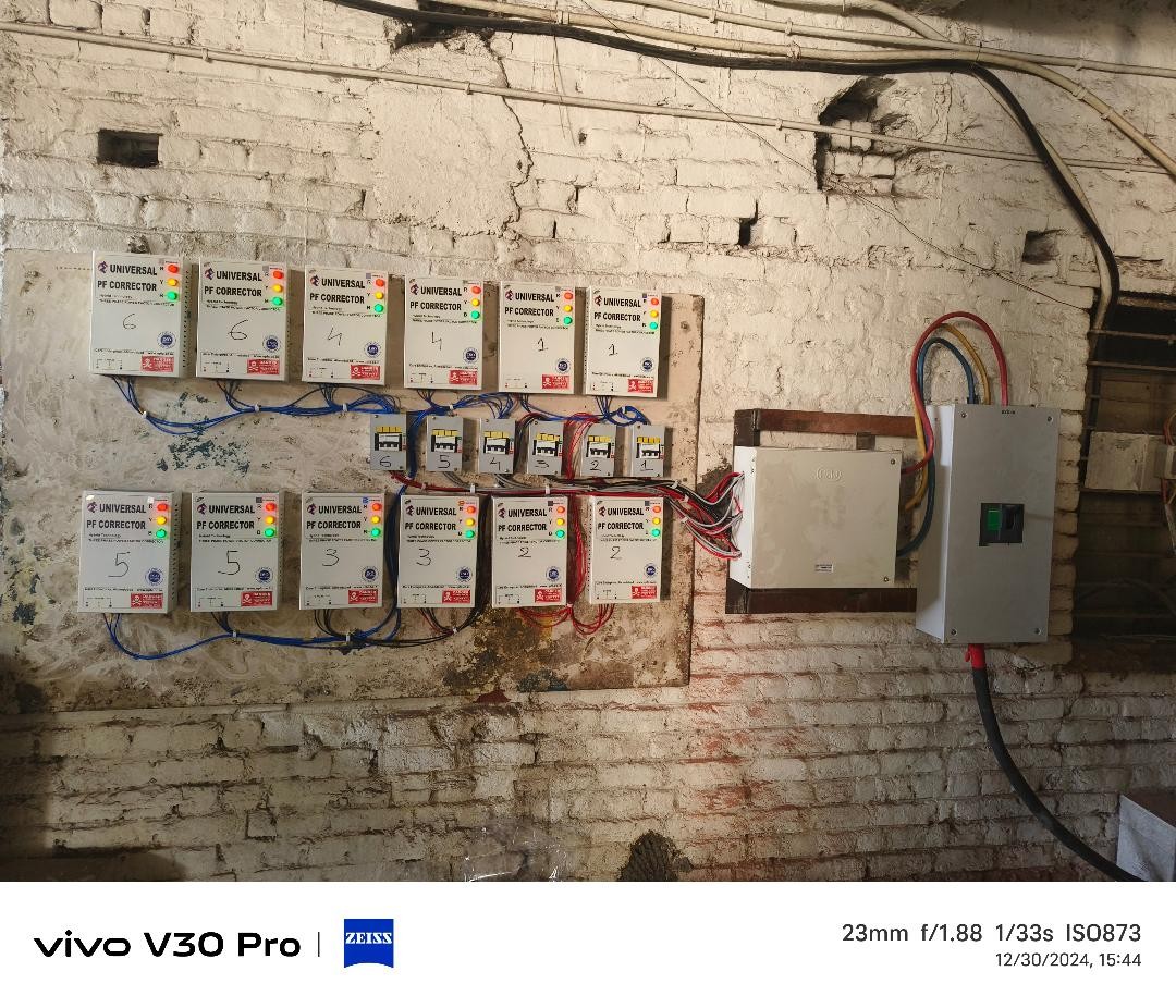 Twelve Universal PF Corrector units labelled and wired